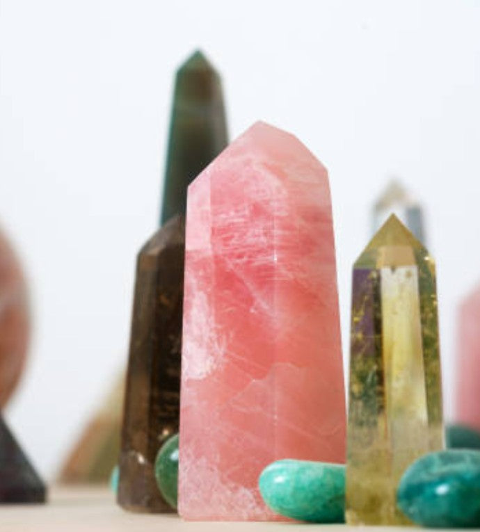 Natural crystal points and polished towers in various stones