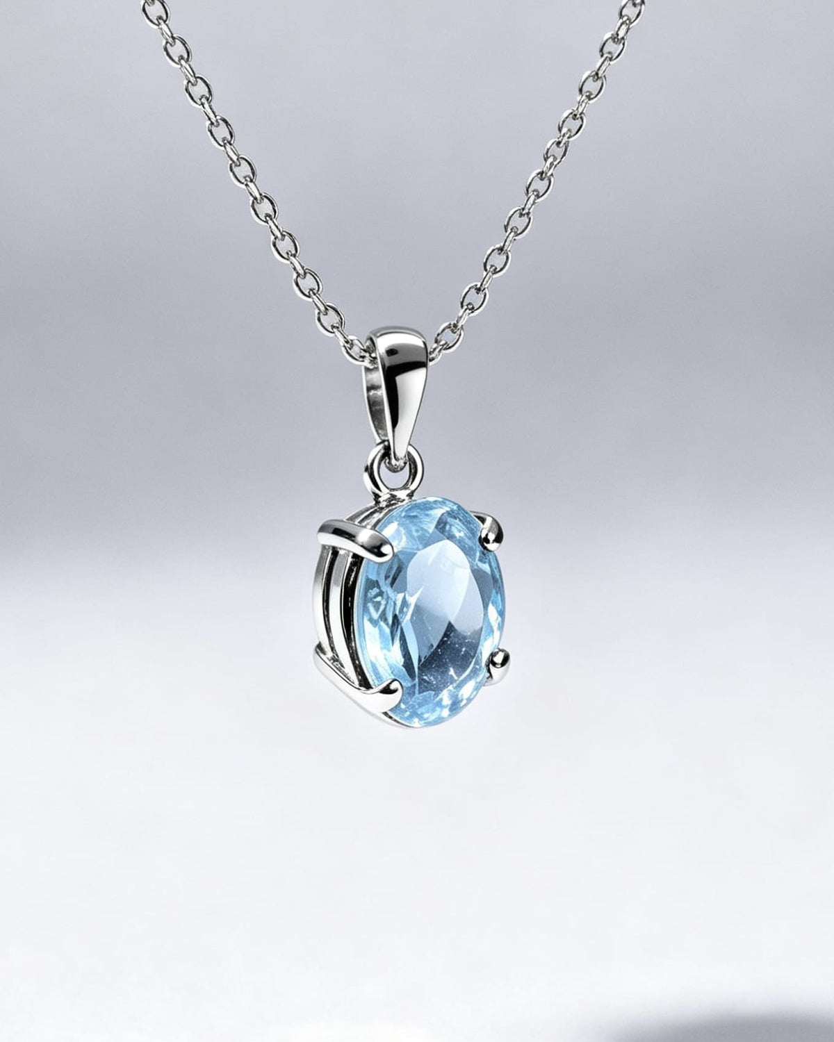 Blue Topaz Crystal Pendant – Oval Silver