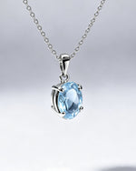Blue Topaz Crystal Pendant – Oval Silver