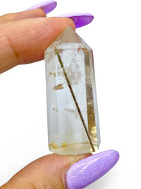 Smoky quartz point with rutile